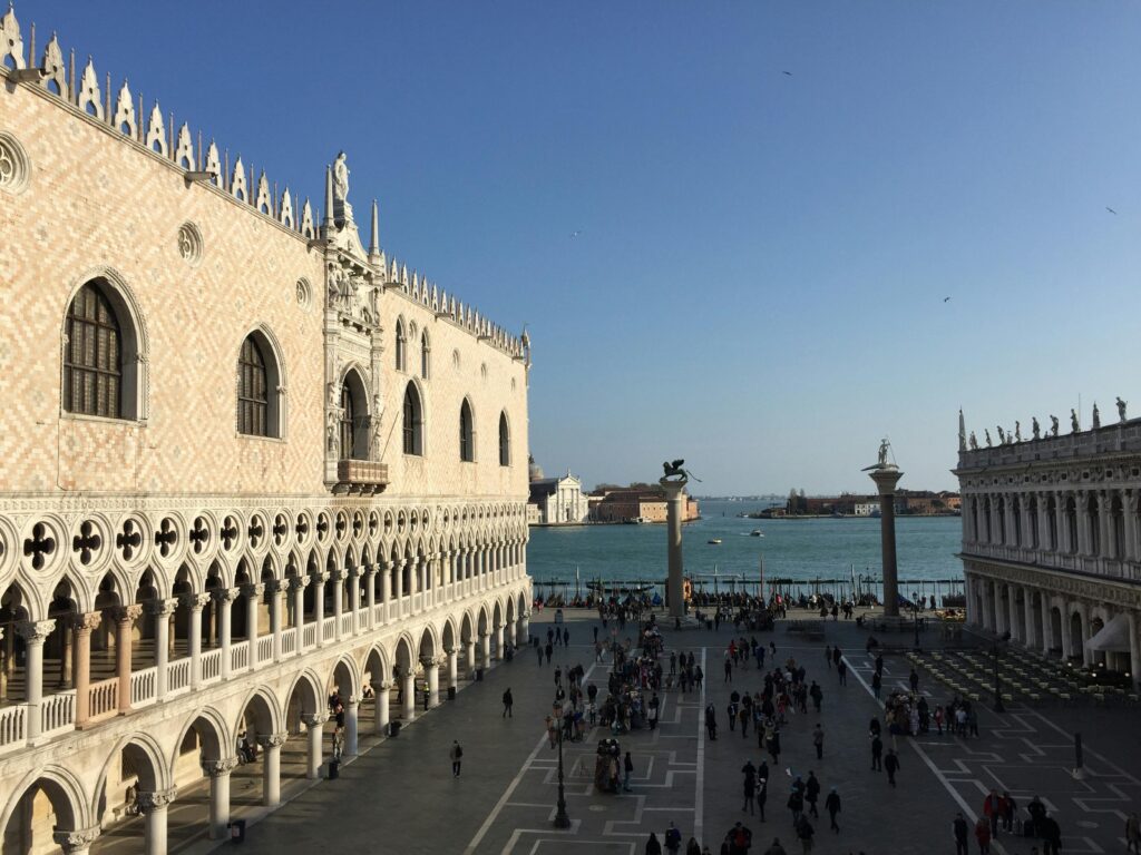 Venice square with ornate architecture and waterfront view.